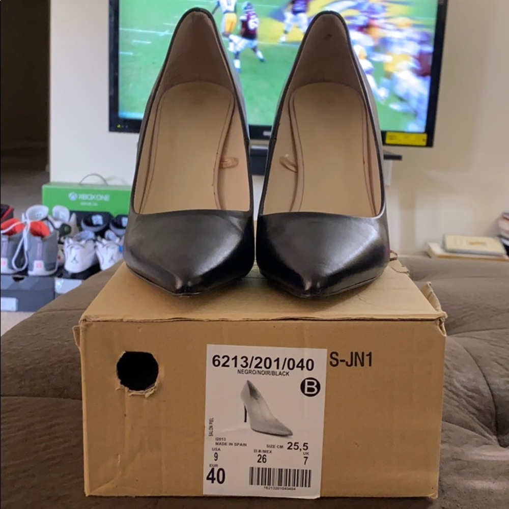 Black leather pumps